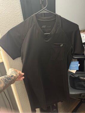 FIT scrubs women scrub top. New with tags. Stretchy spandex-like material.